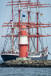 Ship sailing in sea against clear sky