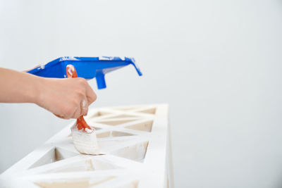 Close-up of woman working over white background