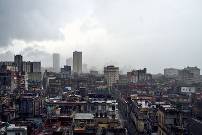 Buildings in city against sky