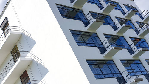 Low angle view of buildings against clear blue sky