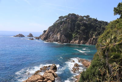 Scenic view of sea against blue sky