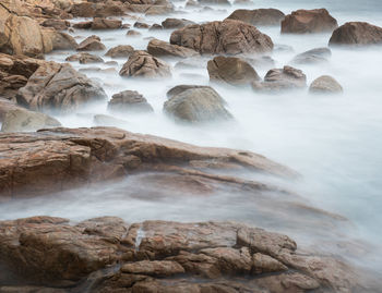 Scenic view of rocks in sea