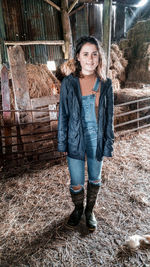 Portrait of a smiling young woman standing outdoors