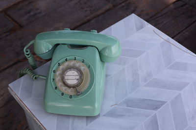 High angle view of telephone on table