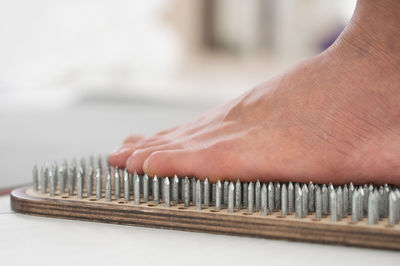 Cropped hand of person on table