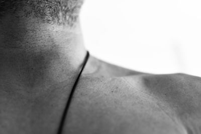 Rear view of a shirtless woman