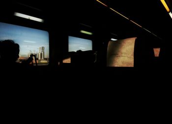 Silhouette built structures against sky