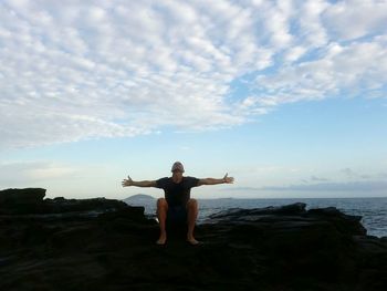 Rear view of man standing on beach