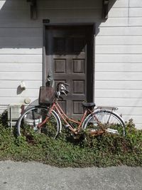 Bicycle parked by building