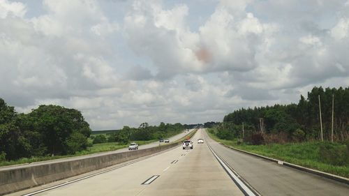 Road against cloudy sky