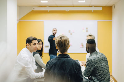 Business people brainstorming during meeting in board room at office