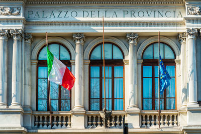 Low angle view of flag against building