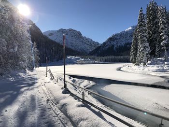 Scenic view of snow covered mountains against sky