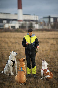 Man with dog on field