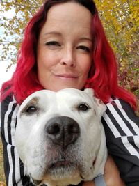 Portrait of young woman with dog