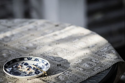 High angle view of clock on table