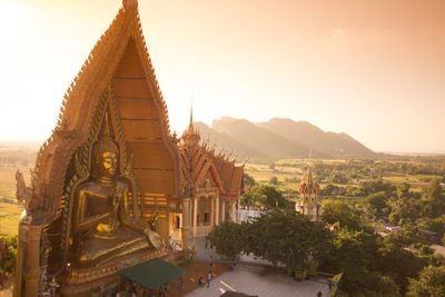 Large buddha statue against the landscape