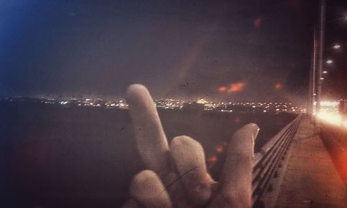 Close-up of human hands on tiled floor