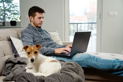 Man using laptop at living room