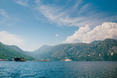 Scenic view of bay against mountains