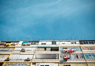 Low angle view of construction site against sky in city