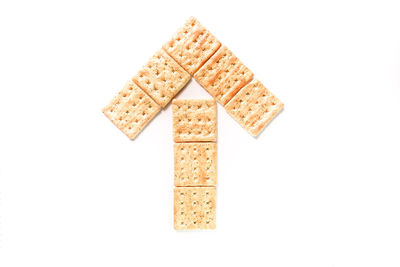 High angle view of bread over white background