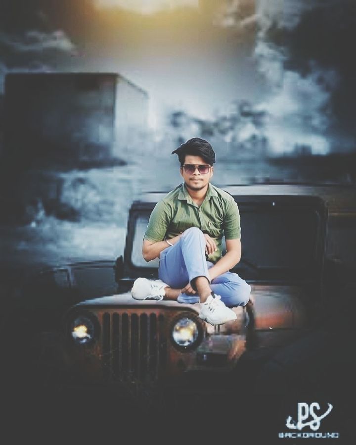 one person, adult, sitting, men, casual clothing, smoke, screenshot, front view, young adult, person, sky, lifestyles, retro styled, clothing, cloud, portrait, darkness, full length, nature, mode of transportation, glasses, transportation, communication, arts culture and entertainment, activity, relaxation, looking at camera, copy space, occupation