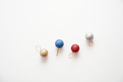 Close-up of christmas decorations on white background