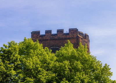 Low angle view of old building against sky,  15th century tower at st mary at the walls church