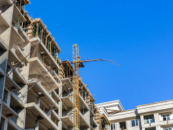 Low angle view of building against clear blue sky