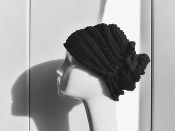 Close-up of mannequin wearing black headwear in store