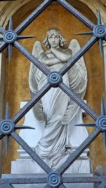 Low angle view of angel sculpture on wall