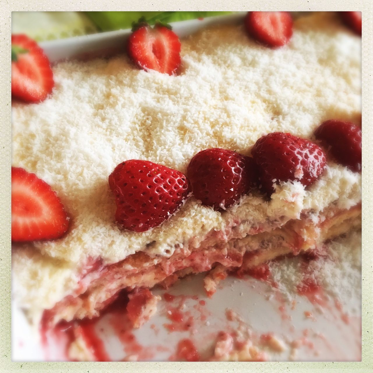 CLOSE-UP OF CAKE WITH STRAWBERRIES