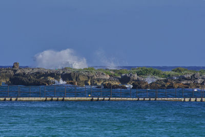 Scenic view of sea against blue sky