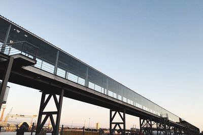 Low angle view of bridge against clear sky