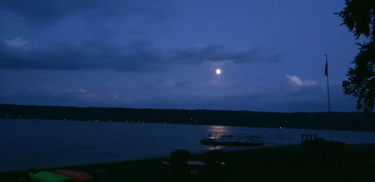 sky, moon, water, cloud, nature, dusk, night, sea, scenics - nature, moonlight, beauty in nature, full moon, tranquility, tranquil scene, horizon, evening, nautical vessel, silhouette, transportation, no people, reflection, outdoors, ocean, tree, astronomical object, plant, beach, mode of transportation, sunset, land