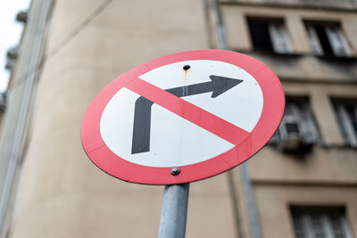 Sign indicating that turning right is prohibited. commercial neighborhood 