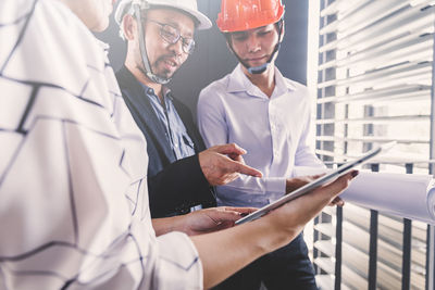 Midsection of man working in office