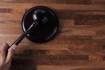 High angle view of person hand on table