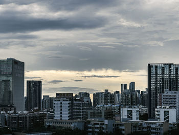 Modern buildings in city against sky