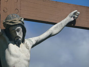 Low angle view of statue against sky