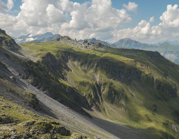 Scenic view of mountains against cloudy sky