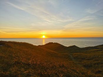 Scenic view of sea against sky during sunset