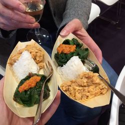 Midsection of woman holding food in plate