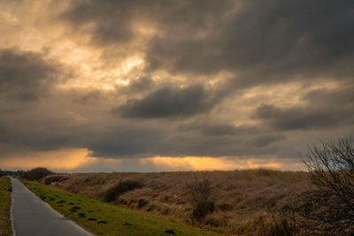 Scenic view of landscape against sky during sunset