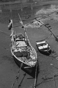 Boats moored at harbor