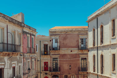 Abandoned building against clear sky