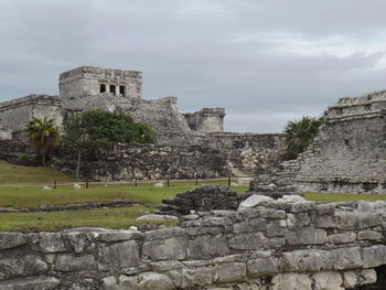 Old ruin building against cloudy sky