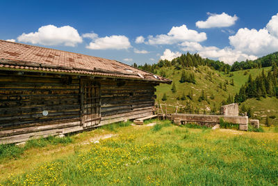 House on field against sky