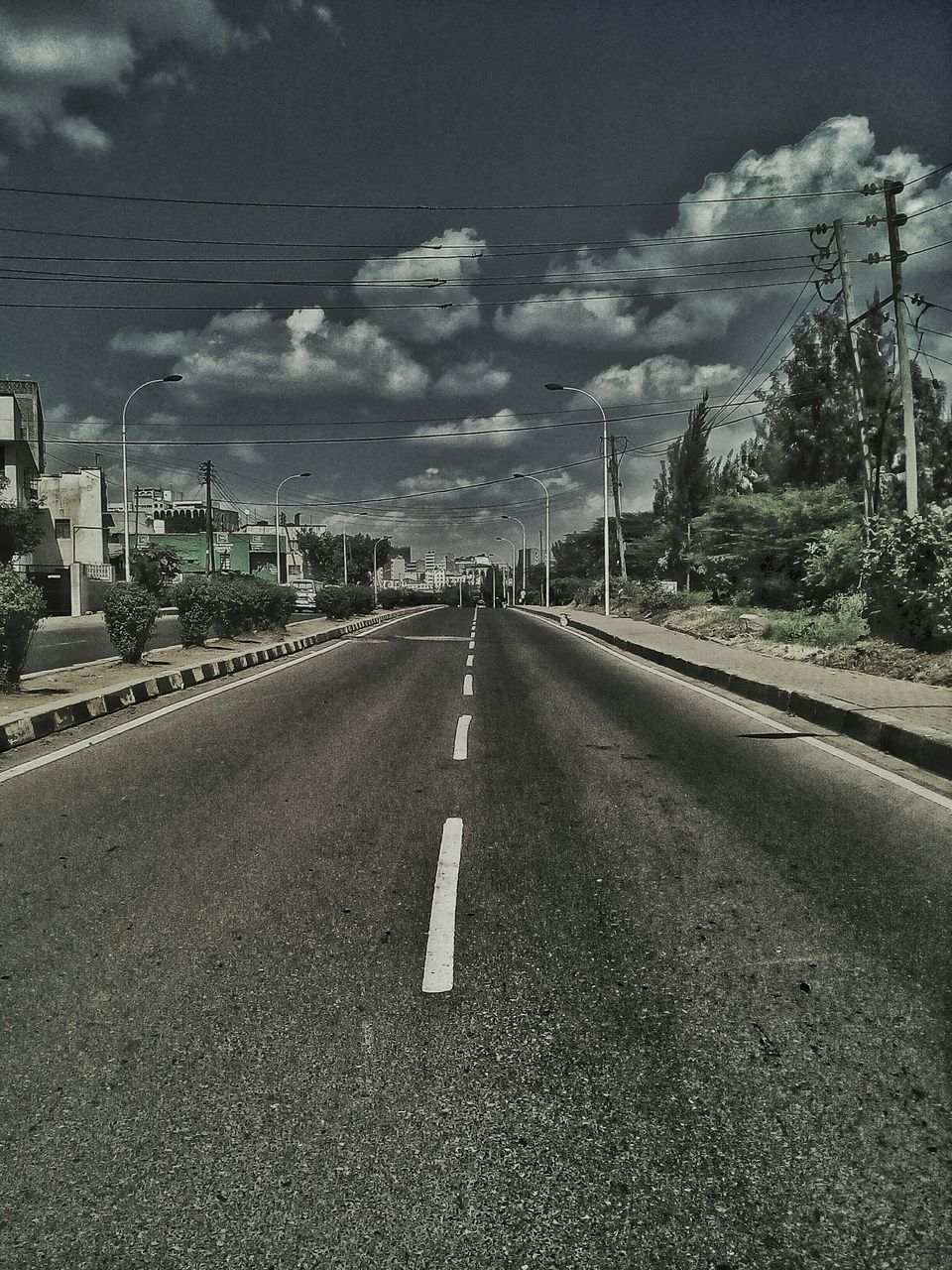 EMPTY ROAD WITH EMPTY ROAD IN BACKGROUND